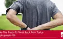 this is the header image for the blog it shows a man in a grey shirt holding his back because of pain a caption reads take the steps to treat back pain today