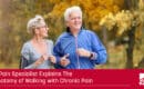 header image for article where A man and his wife go walking in the park to reduce their chronic pain as recommended by a pain specialist a caption reads A Pain Specialist Explains The Anatomy of Walking with Chronic Pain