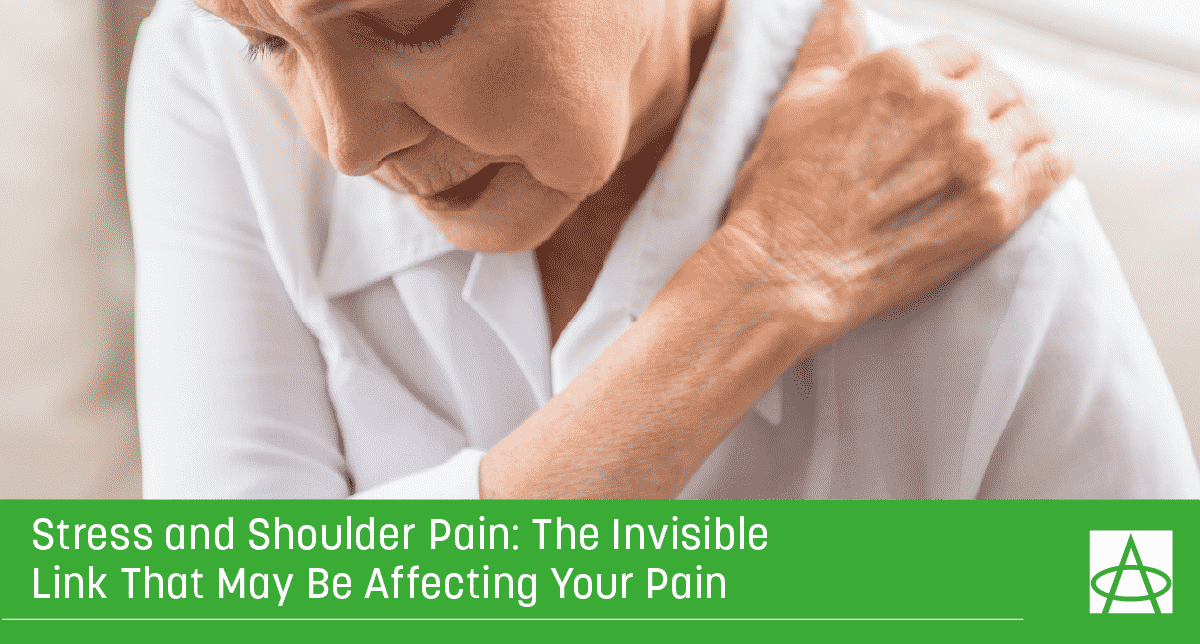 an older woman wearing a white shirt grabs her shoulder in pain
