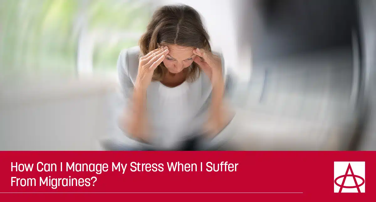 Woman experiencing headache.